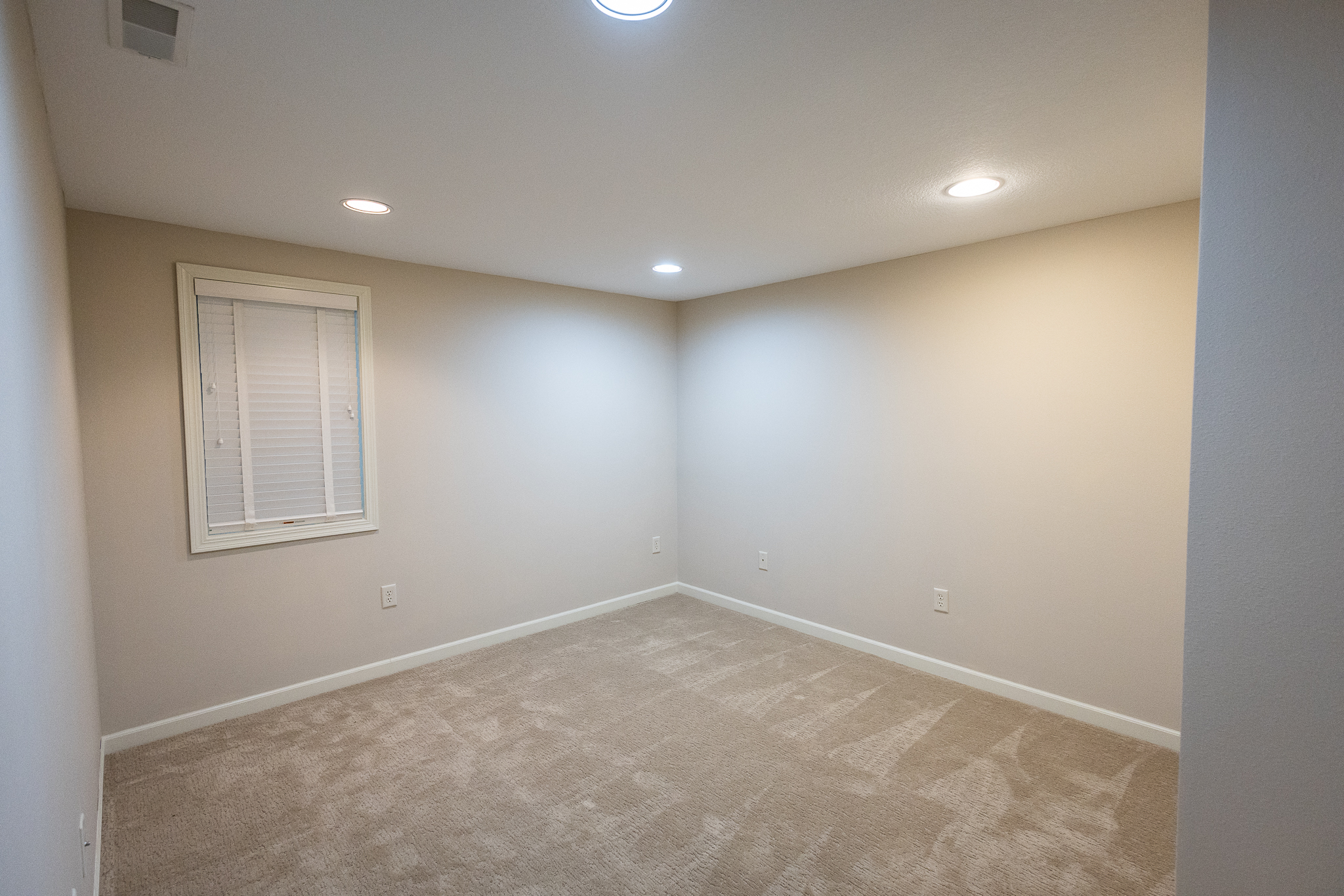 Lower level bedroom with egress window