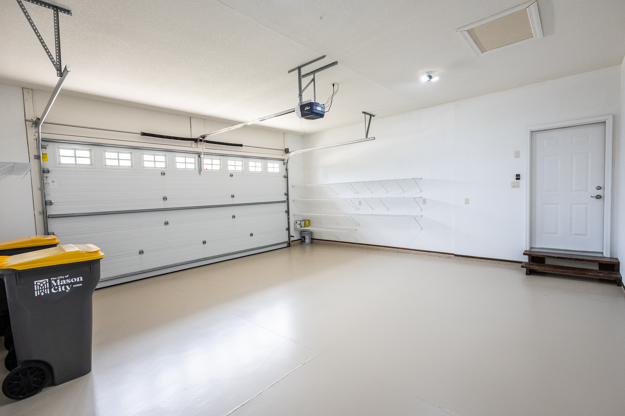 Attached garage with painted floor